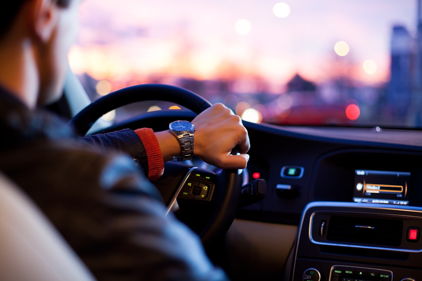Driver navigating city streets for local car travel