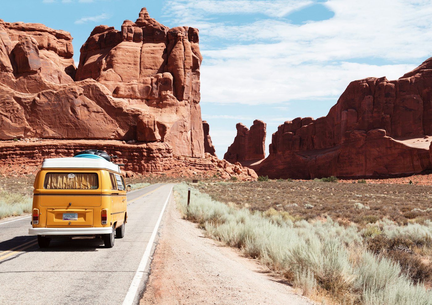 Road trip vehicle on an open highway for outstation travel